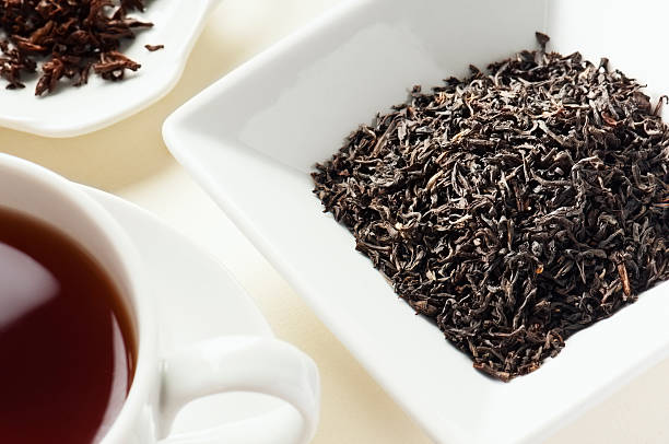 istock Assam Tea Leaves tea leaves behind cup of tea 172455472