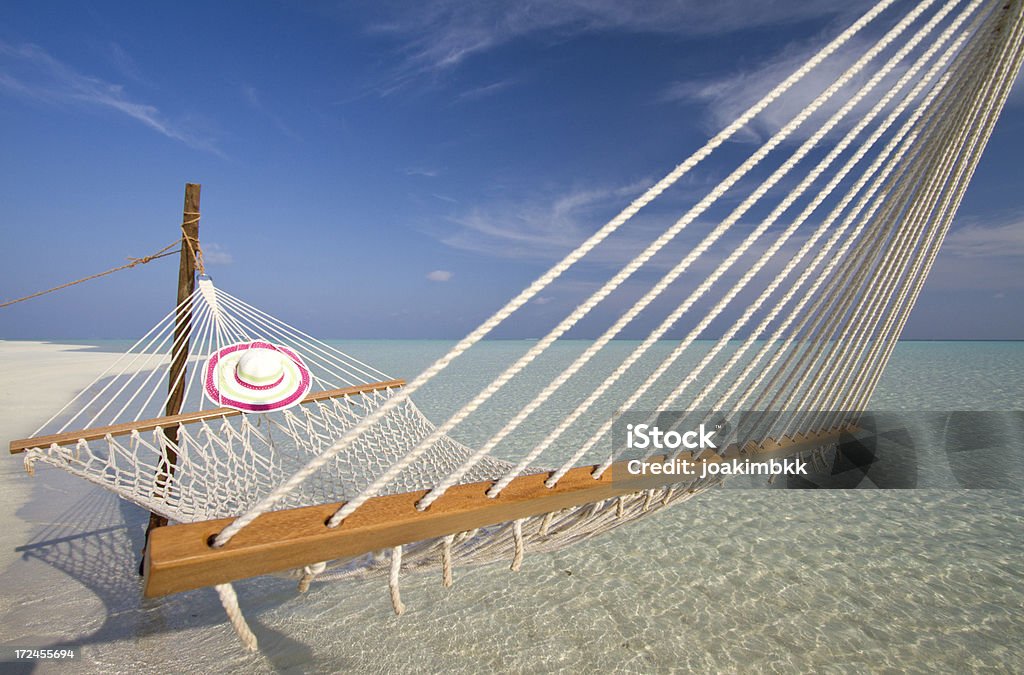 paradisiac Fishnet hamaca en una playa - Foto de stock de Actividades recreativas libre de derechos