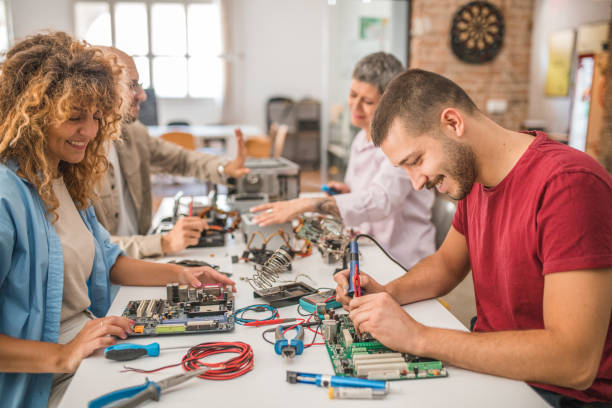 istock A group of students learn about hardware, motherboard, soldering in an electronics class 1724563117