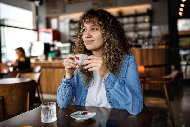 Young woman enjoying coffee at a cafe