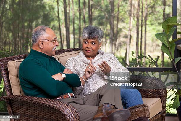 Relationships Senior Couple On Screened Porch Arguing Stock Photo - Download Image Now