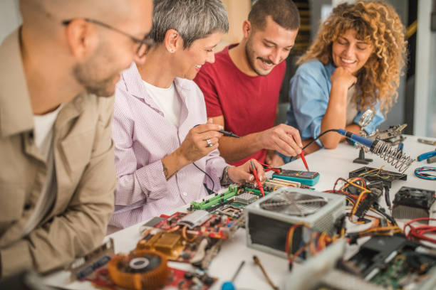 istock A group of students learn how to use a multimeter. They sit in the classroom next to the teacher who explains it to them 1724569004