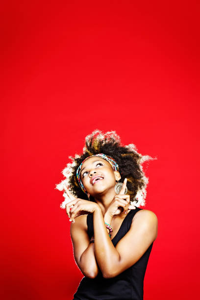 istock Things are looking up! Cute woman points at empty space 172457238