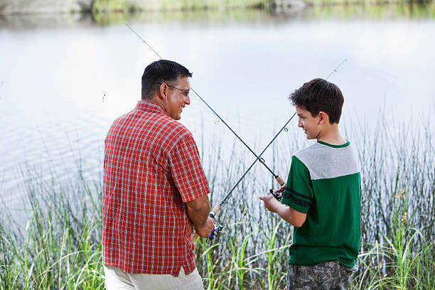istock Hispanic father and son fishing 172457330
