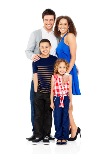 beautiful happy family cuddling in a white photo studio. Mom, dad and daughter play and have fun. mortgage for a young family. parent-child relationship