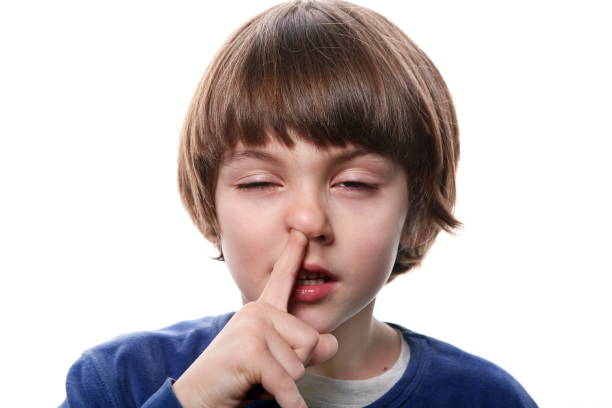 istock Little boy picking a finger up his nose 172457709