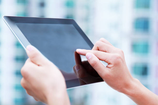 istock Lady utilizing the new digital tablet-XXXL 172458015