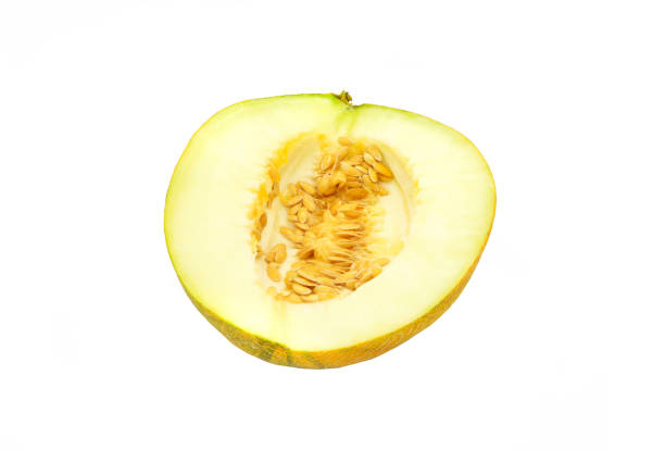 Cut melon with seeds close-up isolated on white background