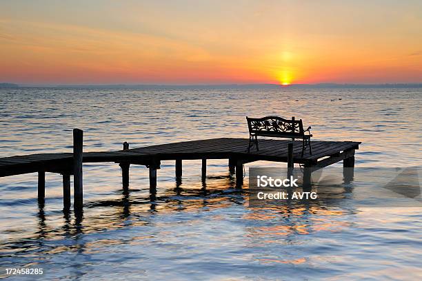 Bench On Dock By Lake At Sunrise Stock Photo - Download Image Now - Beach, Beauty In Nature, Bench