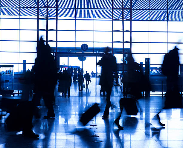 istock People silhouettes at airport building 172458340