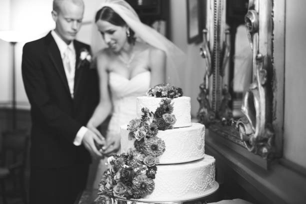 istock Happy Bride and Groom Cutting Wedding Cake 172458667