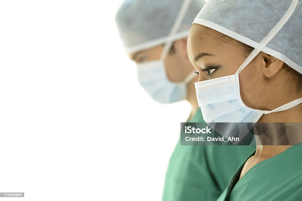 Los cirujanos en funcionamiento la habitación - Foto de stock de Adulto libre de derechos
