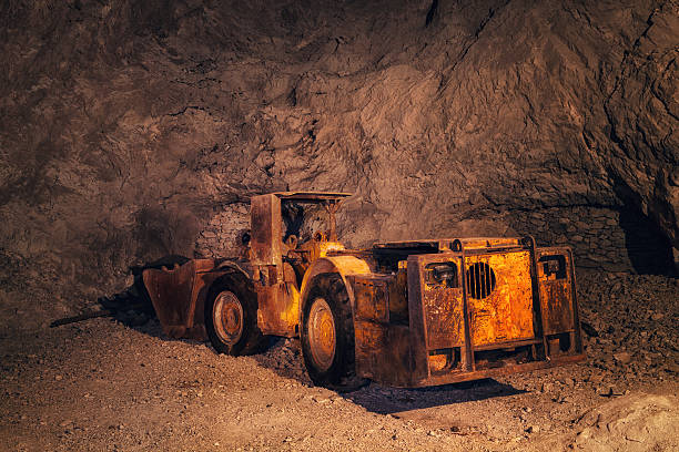 Mine Truck Old, rusty mining machine deep underground in a lead and zinc mine (Mezica, Slovenia). lead mine stock pictures, royalty-free photos & images