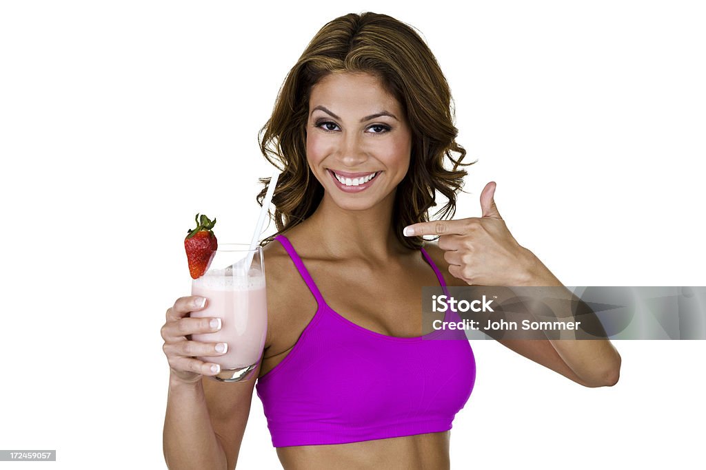 Mujer apuntando a un licuado de frutas. - Foto de stock de Mujeres libre de derechos