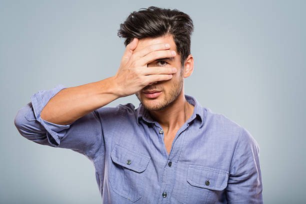 istock Man covering his eyes, peeking 172459117