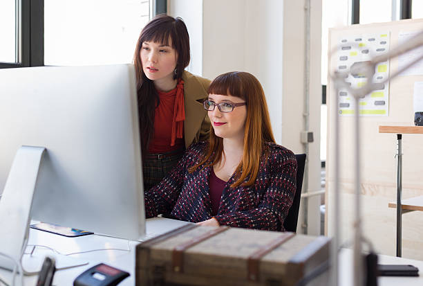 istock Two female coworkers in a startup business 172459314
