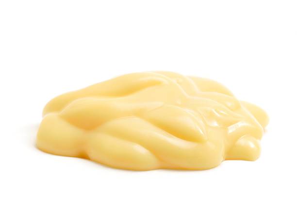 Custard "Custard, isolated against a white background." custard stock pictures, royalty-free photos & images
