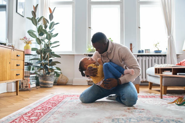 istock Dad and his son having a great time together in their house 1724604629