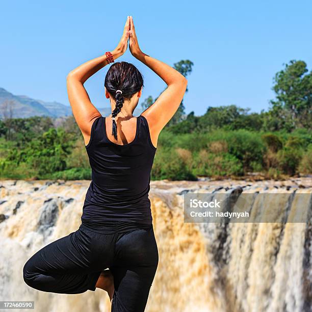 Young Woman Practicing Yoga Stock Photo - Download Image Now - Adult, Adults Only, Agricultural Field