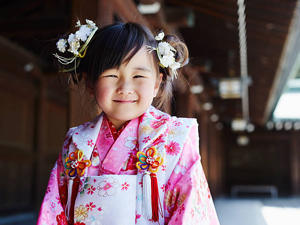 Young smiling girl in pink and white kimono stock photo