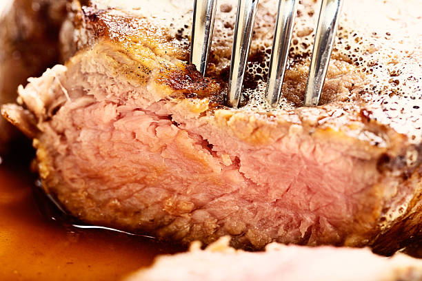 istock Extreme close-up of grilled steak being pierced by fork 172461476