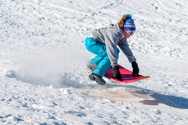 istock Young Girl on Sled in Winter 172461520