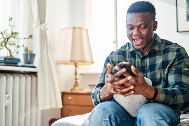 istock Caring father holding his newborn baby while sitting at home 1724615789