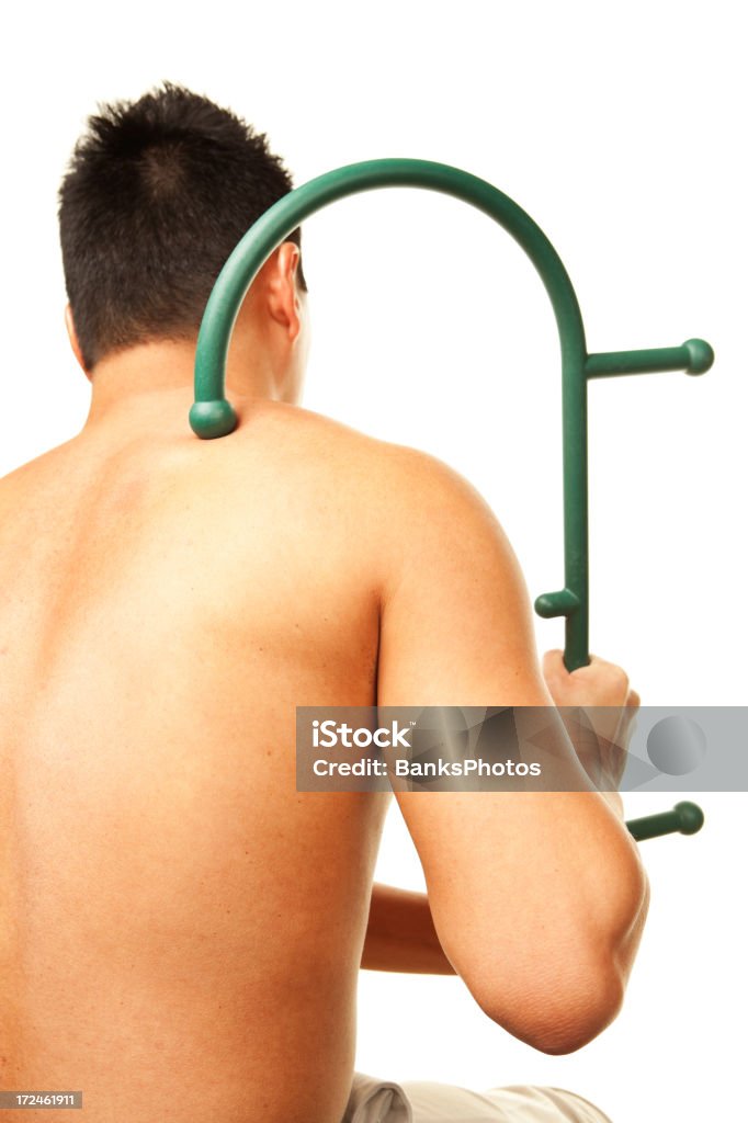 Homem com terapêutica Massager para aliviar dores de costas - Royalty-free Adulto Foto de stock