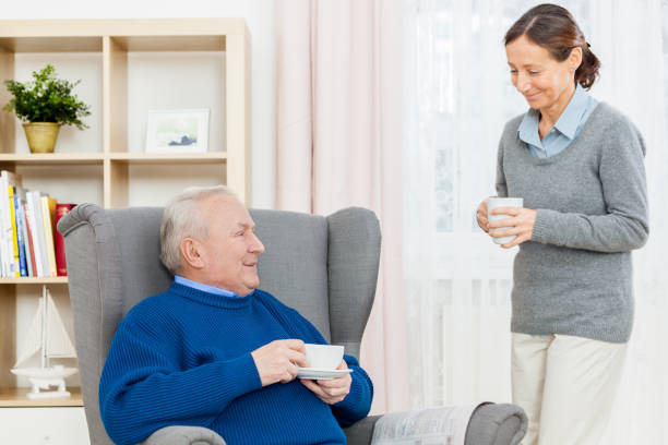 istock Senior Man In Wing Chair with Caregiver 172461985