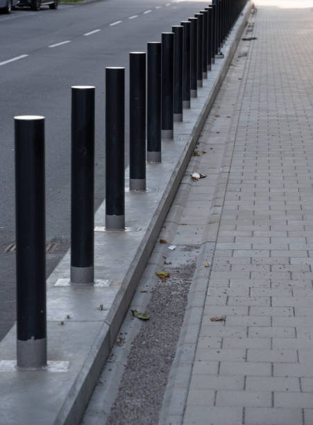 istock Metal poles protecting a building and sidewalk.. 1724621624