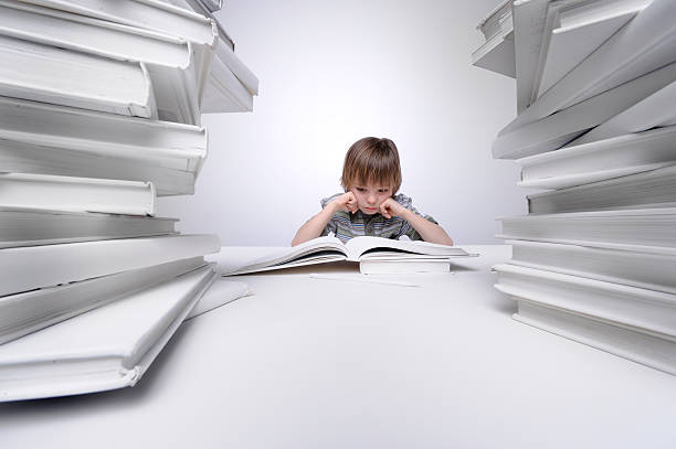 istock Young boy frustrated with his homework. 172462643