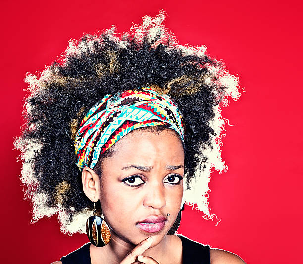 istock Worried afro-haired cutie with finger on lips 172463678