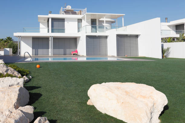 istock white holiday bungalow with turquoise swimming pool Cyprus 172464230