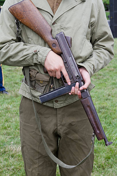istock World War II Soldier Holding a Thompson Sub-machine Gun 172464250