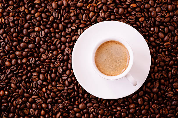 istock Cup of Espresso surrounded by coffee beans 172465113