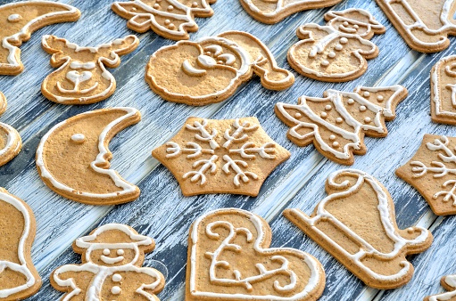 Sweet gingerbreads on a wooden table.
