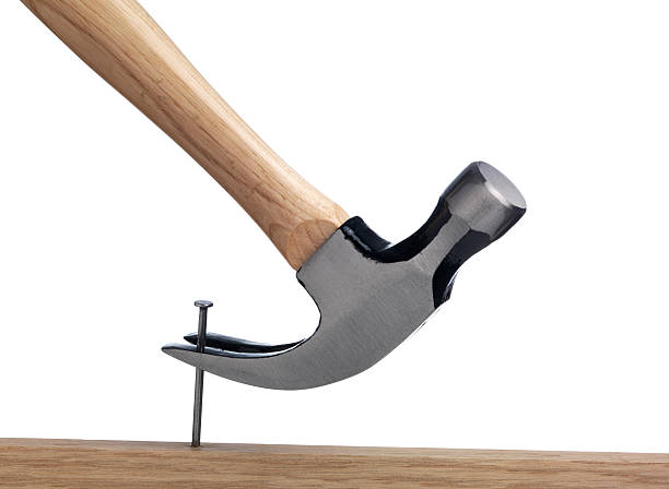 istock Hammer with Nail and Board  isolated 172465458