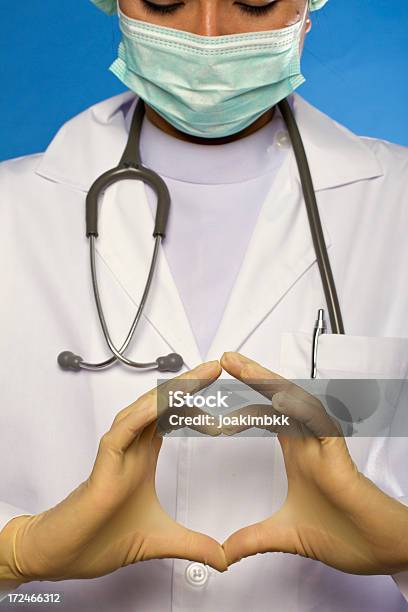 Foto de Símbolo Do Coração e mais fotos de stock de Fundo azul - Fundo azul, Profissional de enfermagem, Adulto