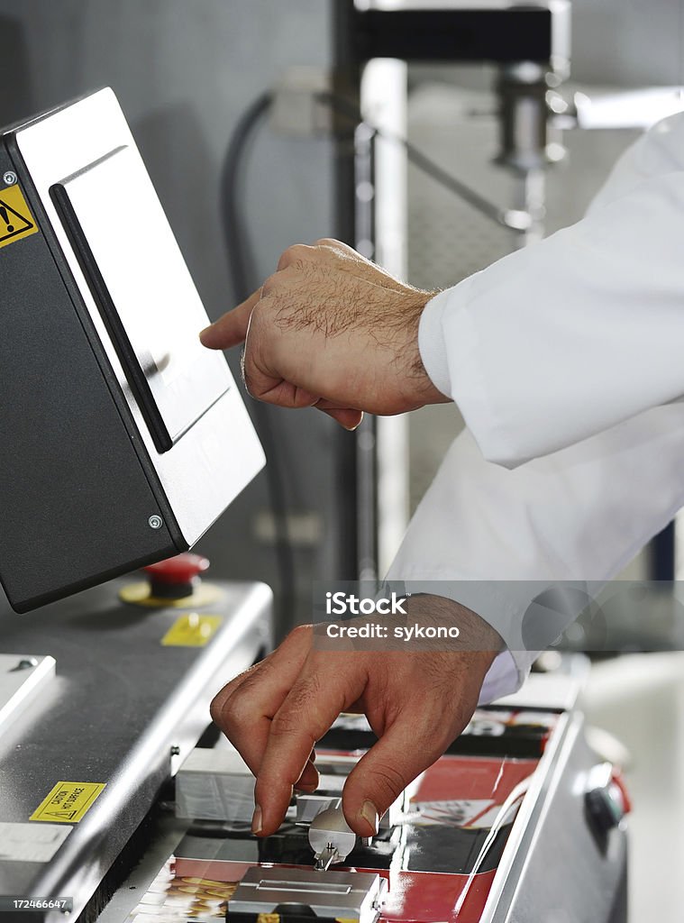 Start Human hand turning key and control production Adult Stock Photo