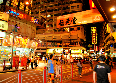 Hong Kong, or formally known as the Hong Kong Special Administrative Region of the People's Republic of China, is one of the most densely populated places in the world. This particular photograph shows a small segment of Hong Kong during nighttime. The color photograph was captured during September of 2010.