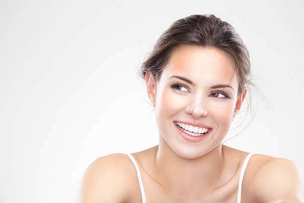 Beauty portrait of a young brunette woman with beautiful smile stock photo