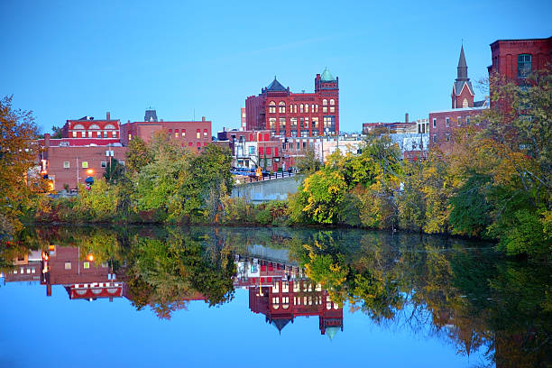 Nashua,New Hampshire Downtown Nashua New Hampshire reflection on the Merrimack River. Nashua is the second largest city in the state of New Hampshire. Nashua is known for its  livability and economic expansion as part of the Boston region nashua new hampshire stock pictures, royalty-free photos & images