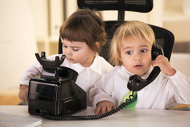 Little girl and boy in customer support center .
