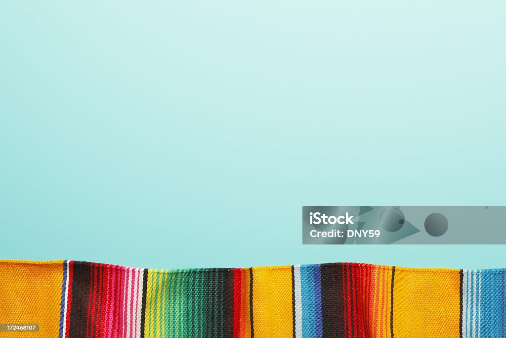 Traditional Mexican Blanket A traditional Mexican blanket on a blue background with copy space at the top Mexican Culture Stock Photo