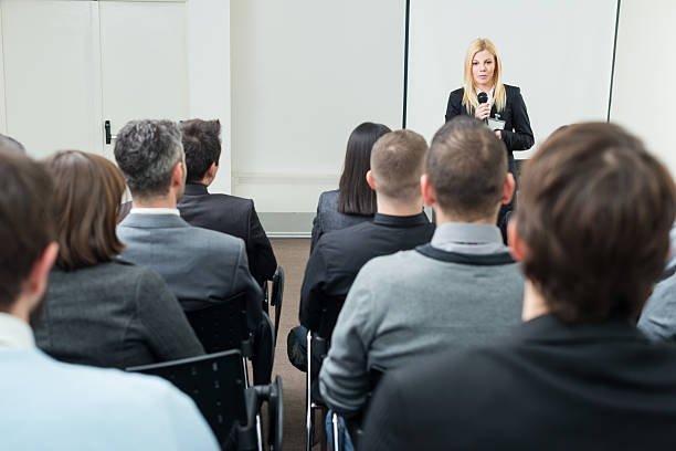 istock Young businesswoman with microphone 172468177