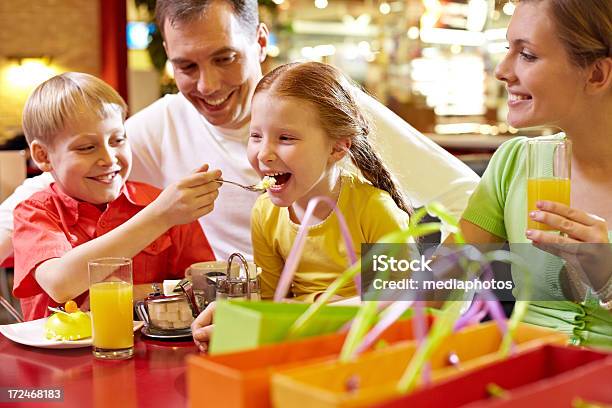 Having Dinner After Shopping Stock Photo - Download Image Now - 30-34 Years, 6-7 Years, Adult