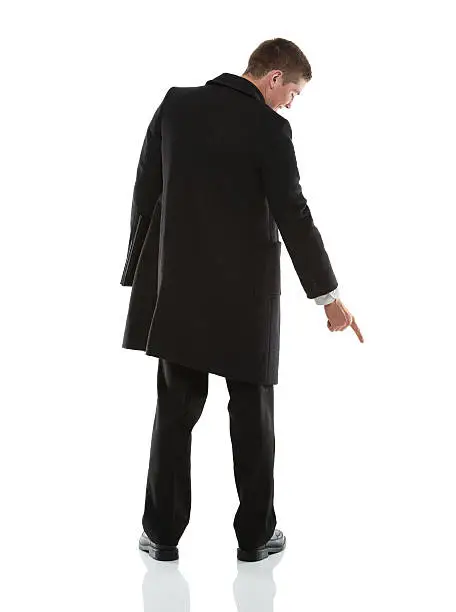 Businessman pointing downward with fingerhttp://www.twodozendesign.info/i/1.png
