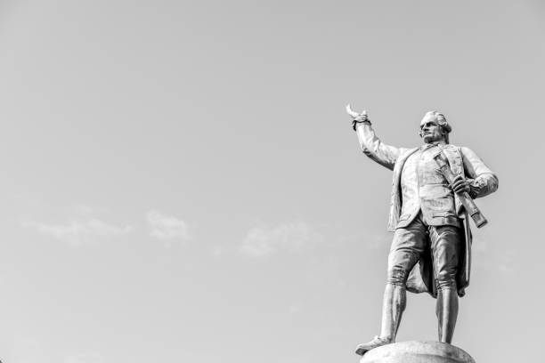 Black and white statue of Capitan Cook, bronze statue, Captain James Cook, The english explorer, navigator and cartographer 1728-1779, by sculptor Thomas Woolner 1879 in Hyde Park Sydney Australia, background with copy space, full frame horizontal composition