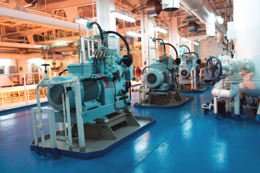 Air compressor set in the engine room of the big crude oil tanker ship.