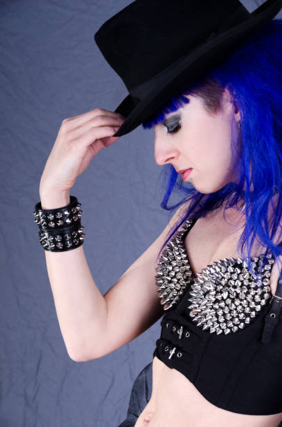 istock Blue haired woman tipping hat in profile. 172468811